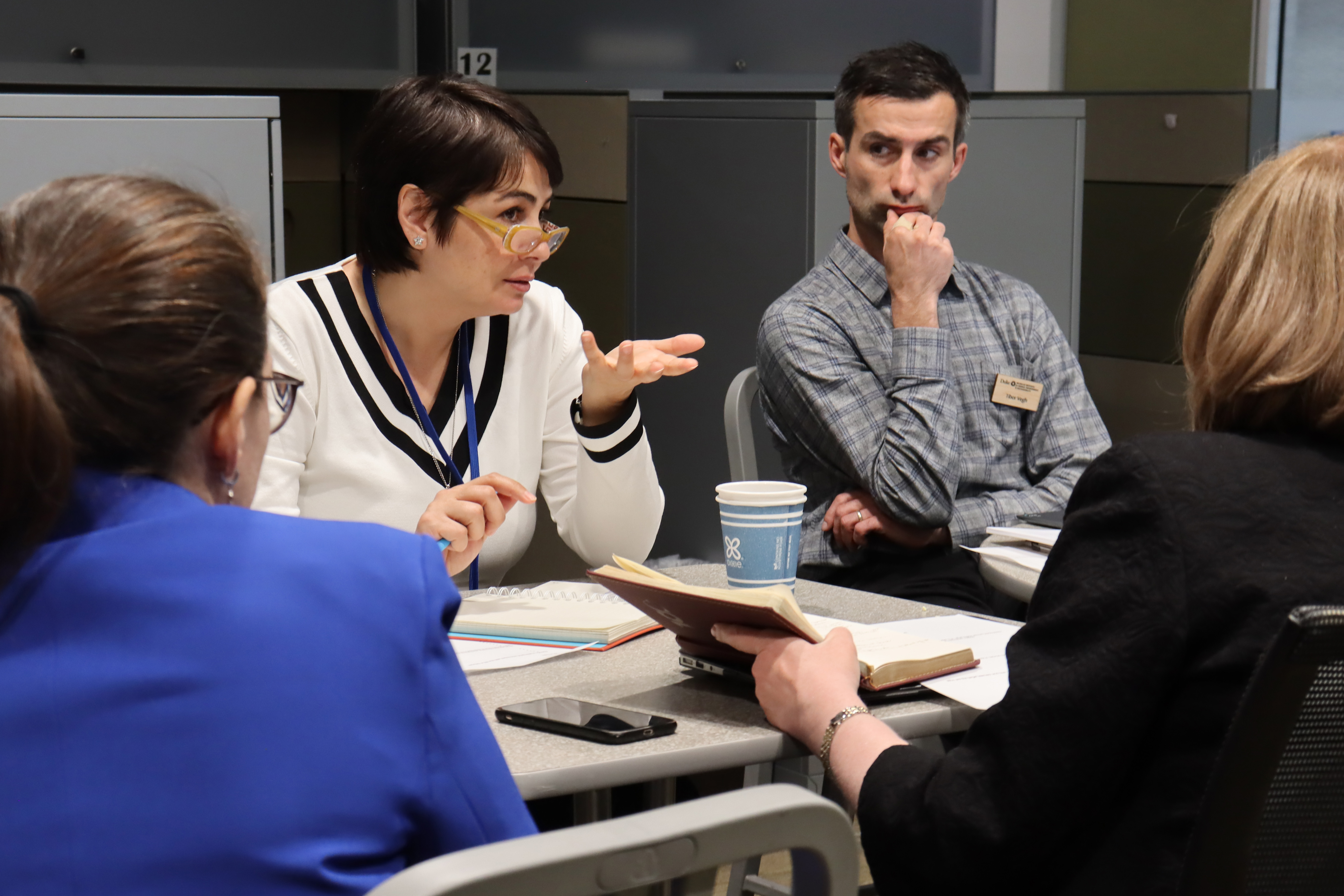 Particpants in the March 22 workshop seated at table in discussion