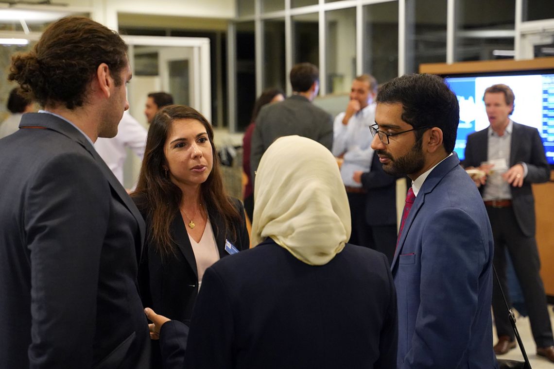 Students and faculty talk at an Energy Week event