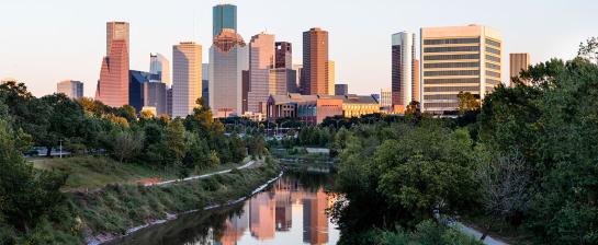 Panoramic view of Houston downtown skyline and reflection in Buffalo Bayou in late afternoon sunlight - image credit Shutterstock/Andrew Bower